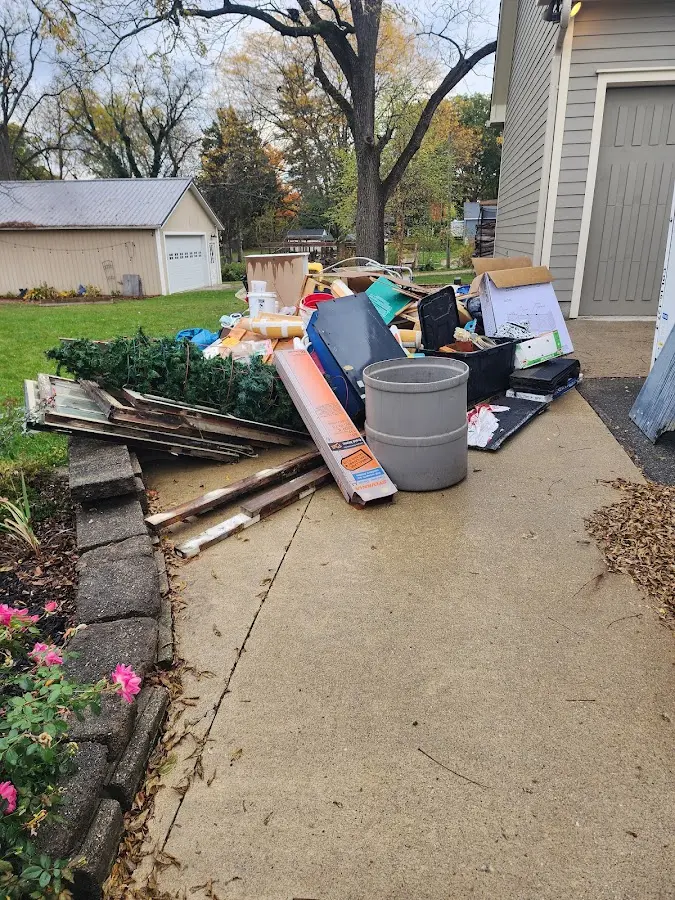 Dumpster being loaded with debris for 30 Yard Dumpster Rental in Boxborough